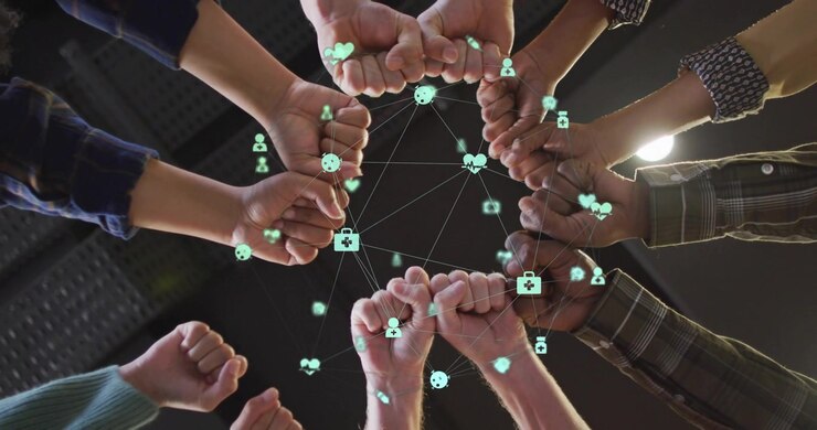 Research team raising fists around floating health network icons and activating pulsing data charts