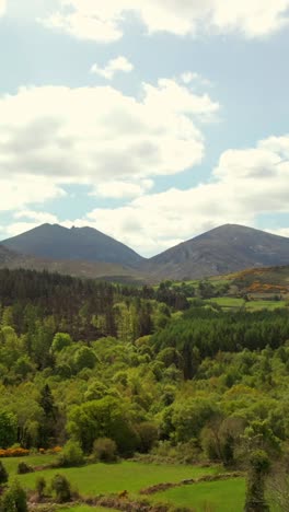 ultra-wide reversing social ratio vertical video of the mourne mountains in newcastle, county down in northern ireland. produced in 1080x1920, 60fps and with rec709 color