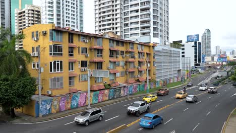 A-street-in-Panama-City,-Panama,-showing-the-diversity-in-architecture:-old-colonial-colorful-buildings-along-with-newer-and-taller-ones