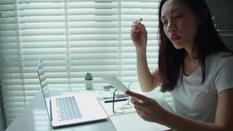 stressed young woman asian calculating monthly home expenses, tax, credit card bills payment and bank account balance not enough money to pay monthly.