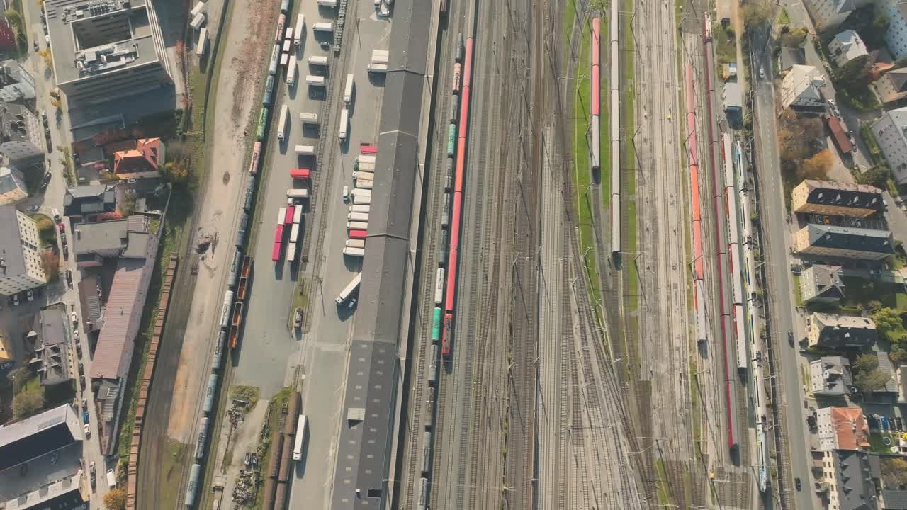 Salzburg Drone, Austria. Aerial View of Central Train Station and Cityscape and misty mountains, top down