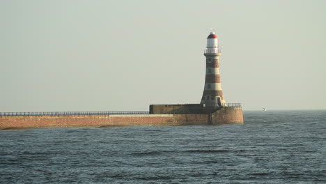 roker lighthouse at the end of the pier on a clear sunny day