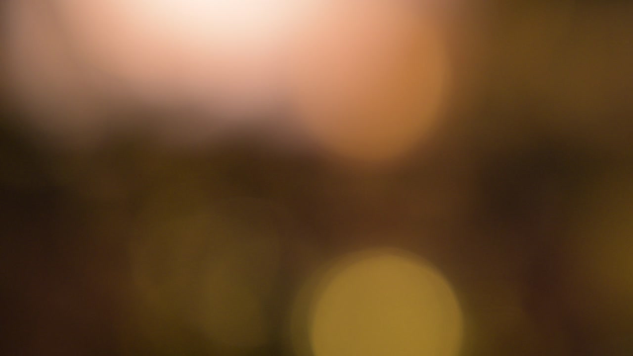 Bokeh, una sfocatura circolare arancione. Per lo sfondo del video di apertura