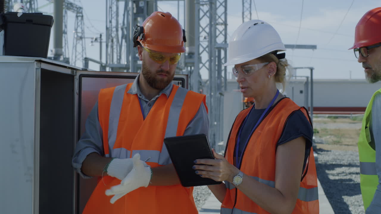 Power Station Workers Discussing Maintenance