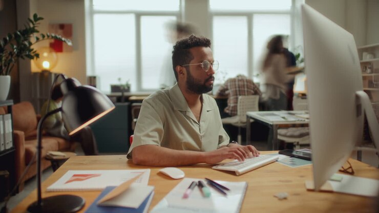 Timelapse of Focused Man Working on Desktop Computer in Open Space Office