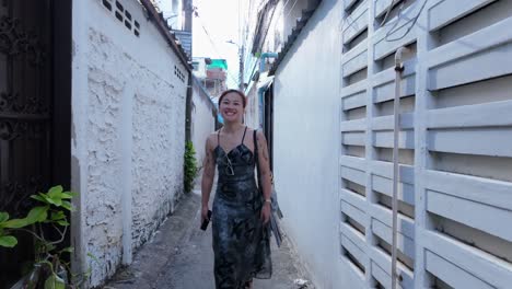woman walking down a bangkok alley