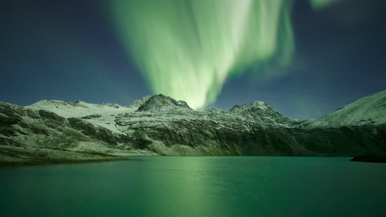 Dazzling Northern lights over Rottenvikvatnet Lyngen Alps Norway