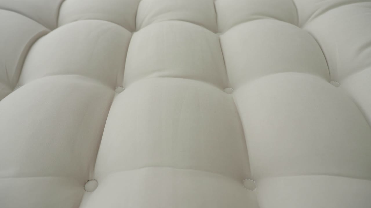 Close-up of a Tufted White Mattress