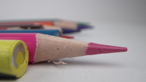 colourful pencils, pink pencil tip in sharp focus