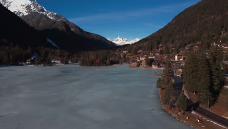 flight over a frozen mountain lakes surrounded by ice capped mountains