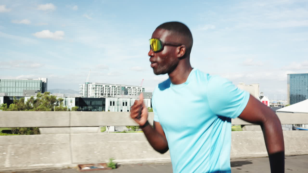 Energetic Man Running on a Bridge in an Urban City