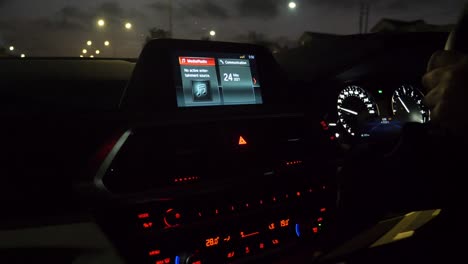 dashboard of a car driving through the night