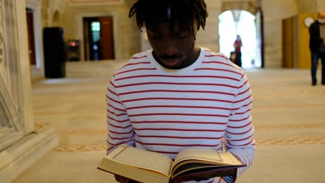 african muslim reading holy book