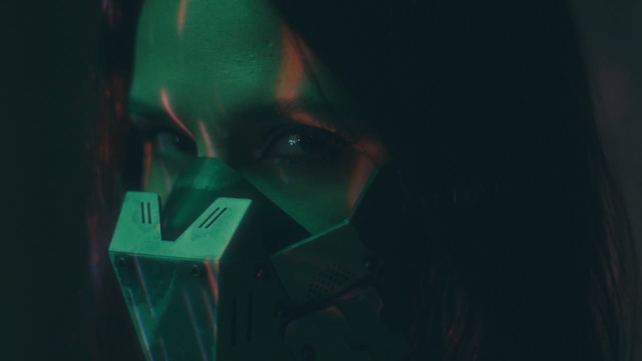Woman in Cyberpunk Mask with Projected Glowing Lights