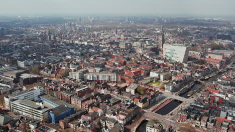 flying over the groningen city with martinikerk church and forum groningen in the netherlands