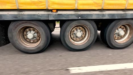 yellow truck driving on highway in wrexham