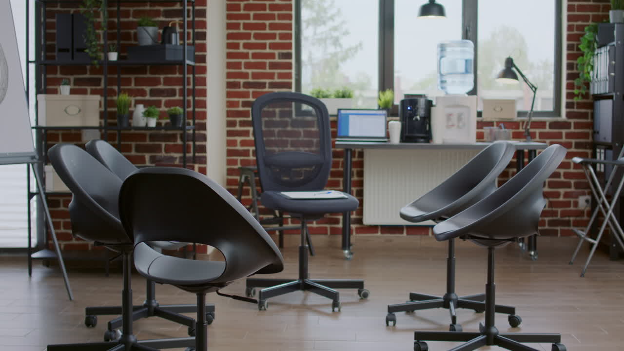 Nobody in office decorated with chairs in circle for aa meeting therapy with group of people