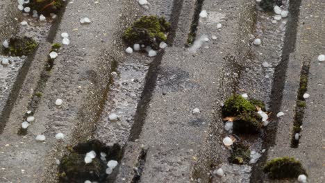 Bad-stormy-weather-ice-hail-and-rain-on-tiled-house-roof