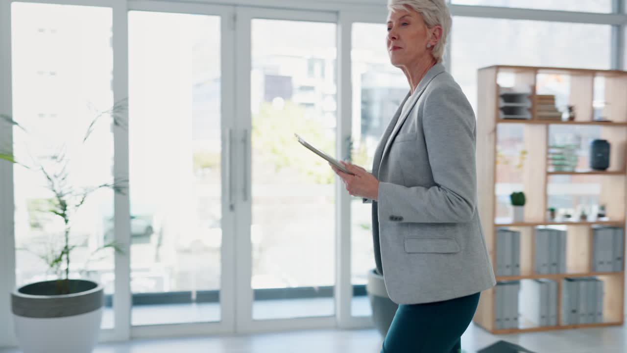 Talking architect, tablet and blueprint