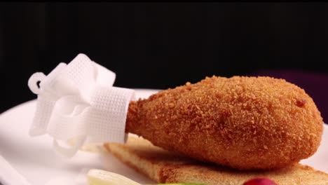 crispy fried chicken drumstick with toasted bread and asparagus