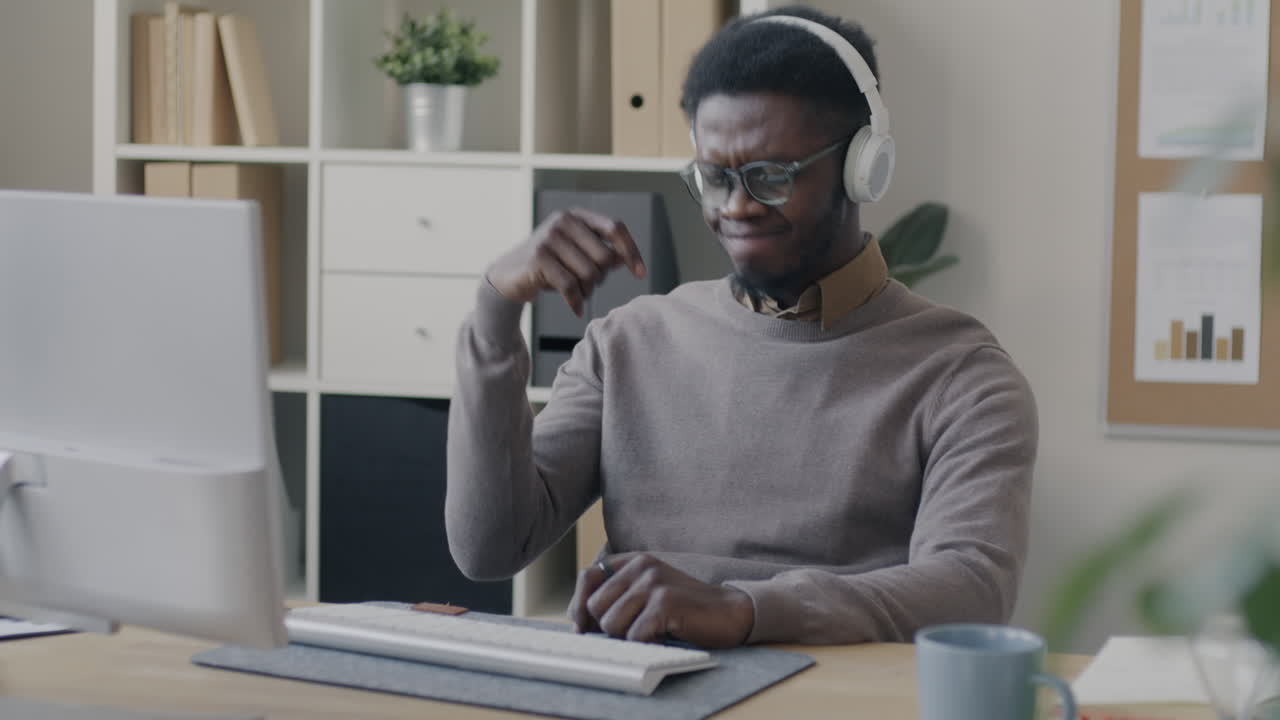 Man Working at a Computer in an Office