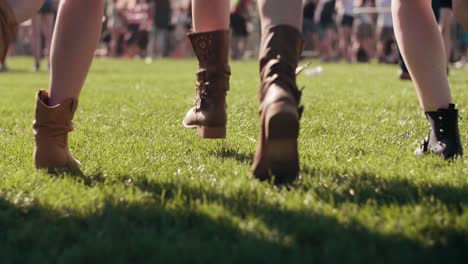 Low-section-of-young-people-running-on-a-fields