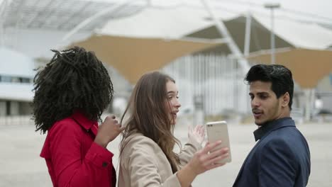 young people having video chat on phone, showing surroundings