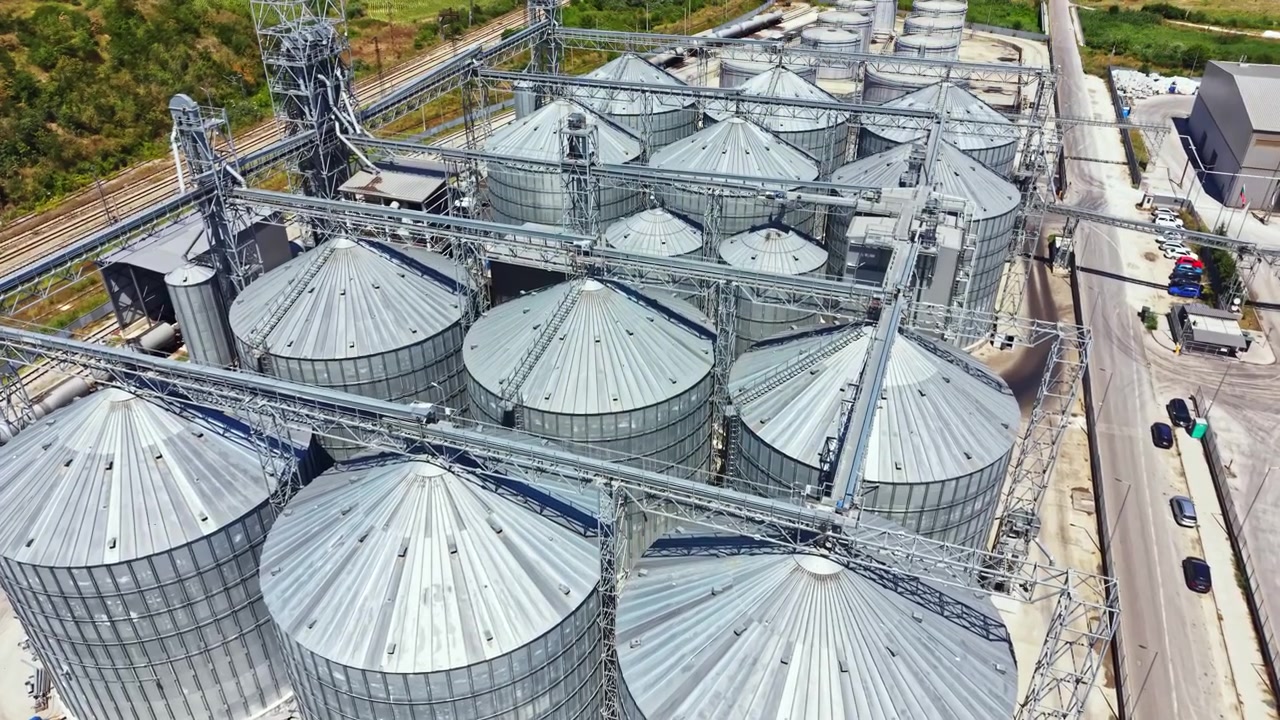 Grain silos and processing facility in a rural area during the day