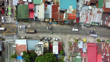 aerial top down view of traffic transport in shanty small town of philippines