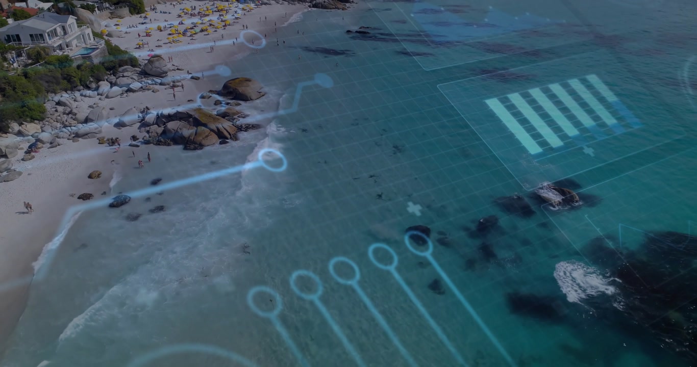 Aerial camera sweeping coastline starting circuit overlay moving across turquoise sea, showing grid