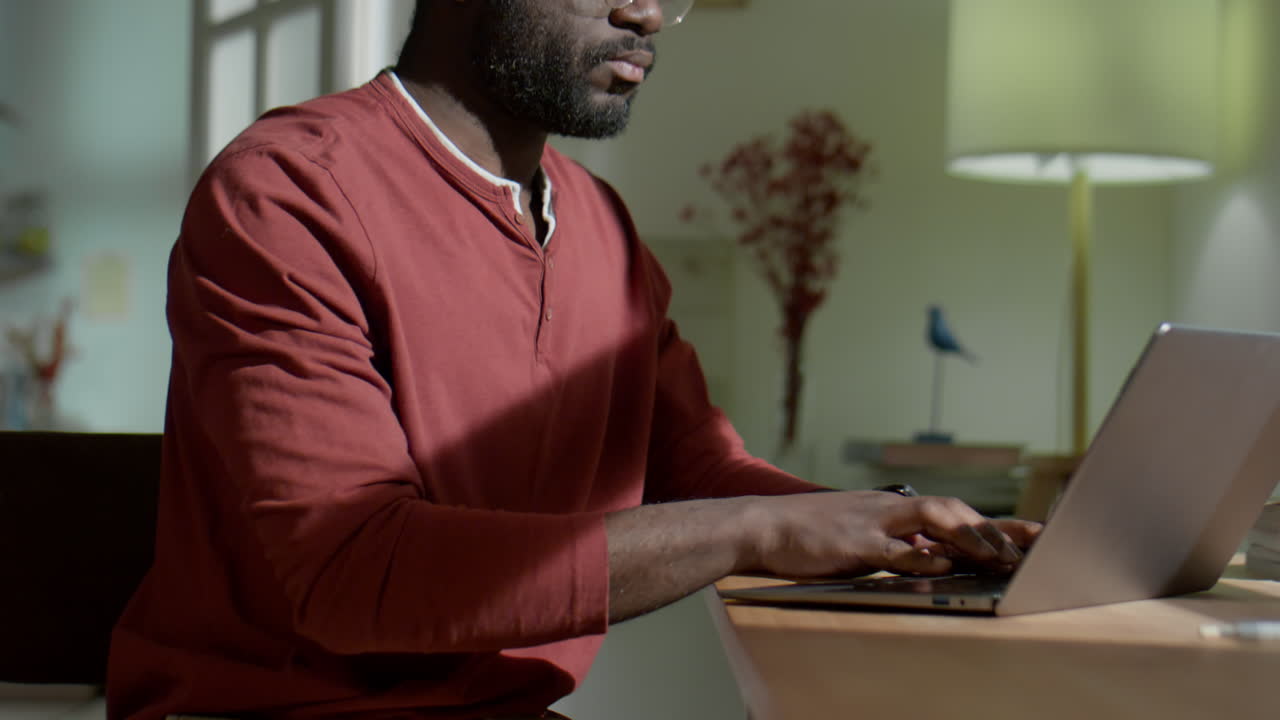 African American Man Working on Laptop at Home