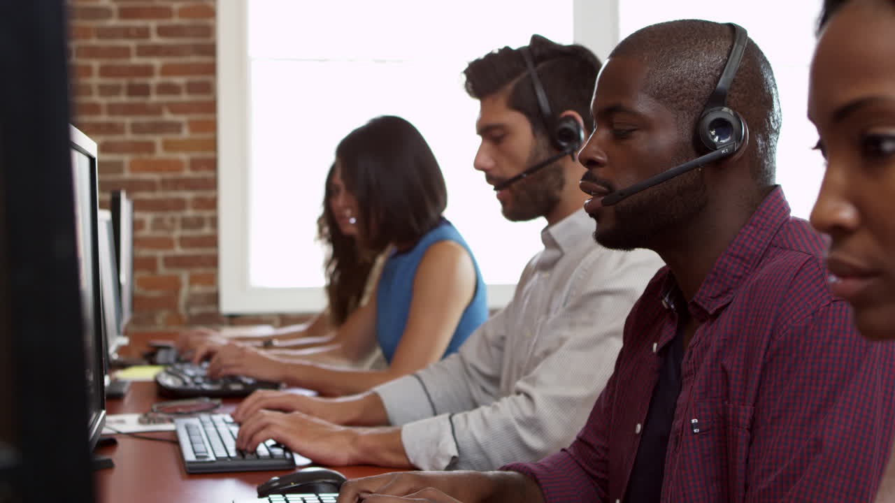 Staff At Desks In Customer Service Department Shot On R3D