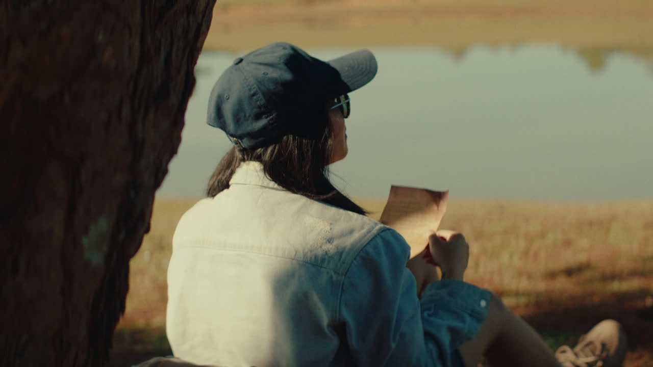 Woman Reading by the Lake