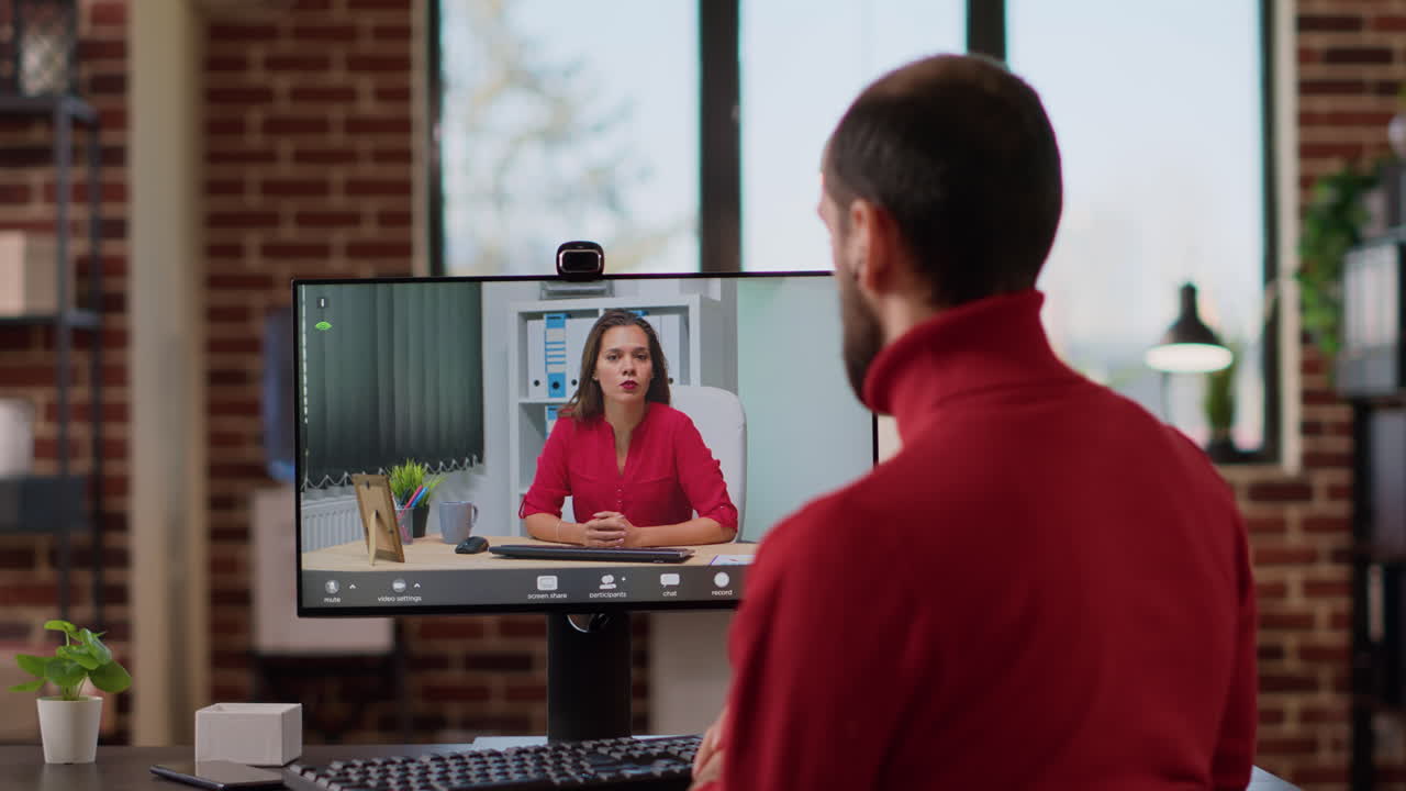 Young businessman talking to manager on remote teleconference