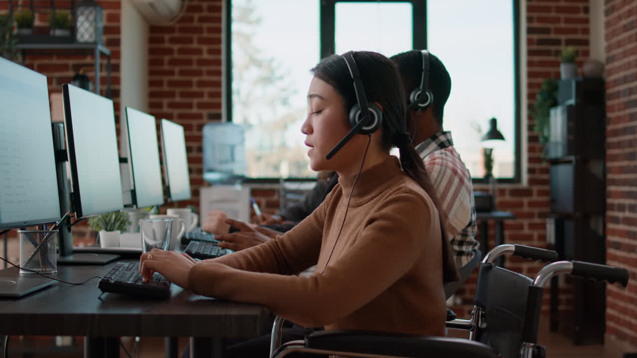 Call center employee using headset to talk to clients