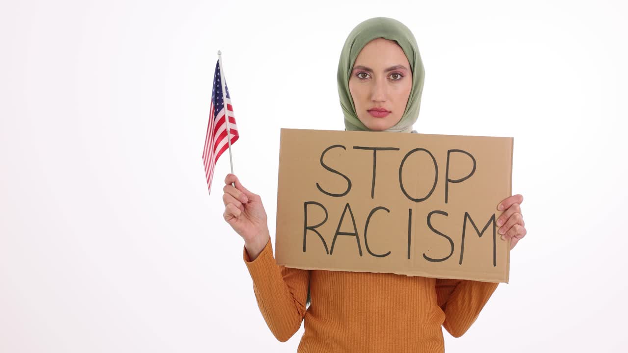 Woman in Hijab Protesting Racism with American Flag