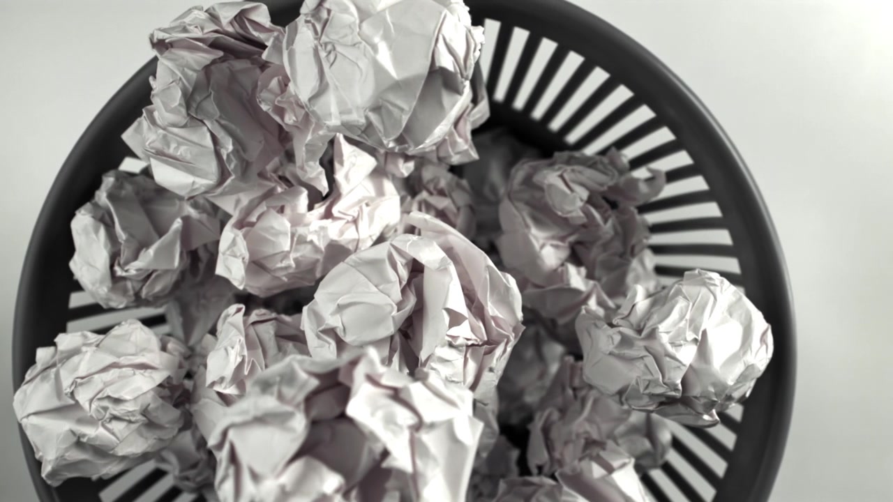 Overhead View of Crumpled Paper in a Trash Can
