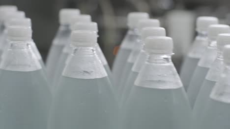 conveyor belt with bottles of drinking water at a modern beverage plant