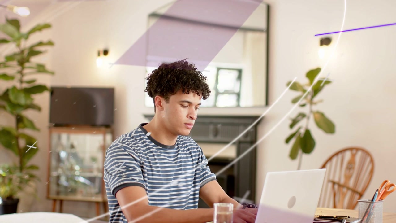 Man touching laptop, typing, scanning and glancing, animated overlays crossing table, working tech