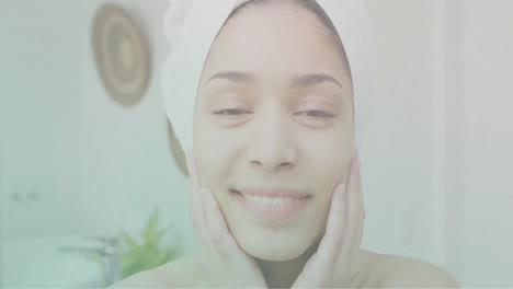 Animación-De-Ondas-En-El-Agua-Sobre-El-Retrato-De-Una-Mujer-Birracial-Feliz-Usando-Una-Toalla-En-El-Baño