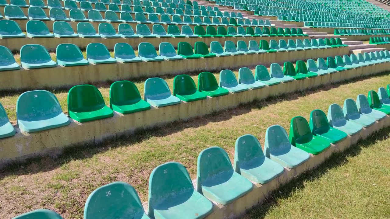 Empty Green Stadium Seats in Outdoor Arena