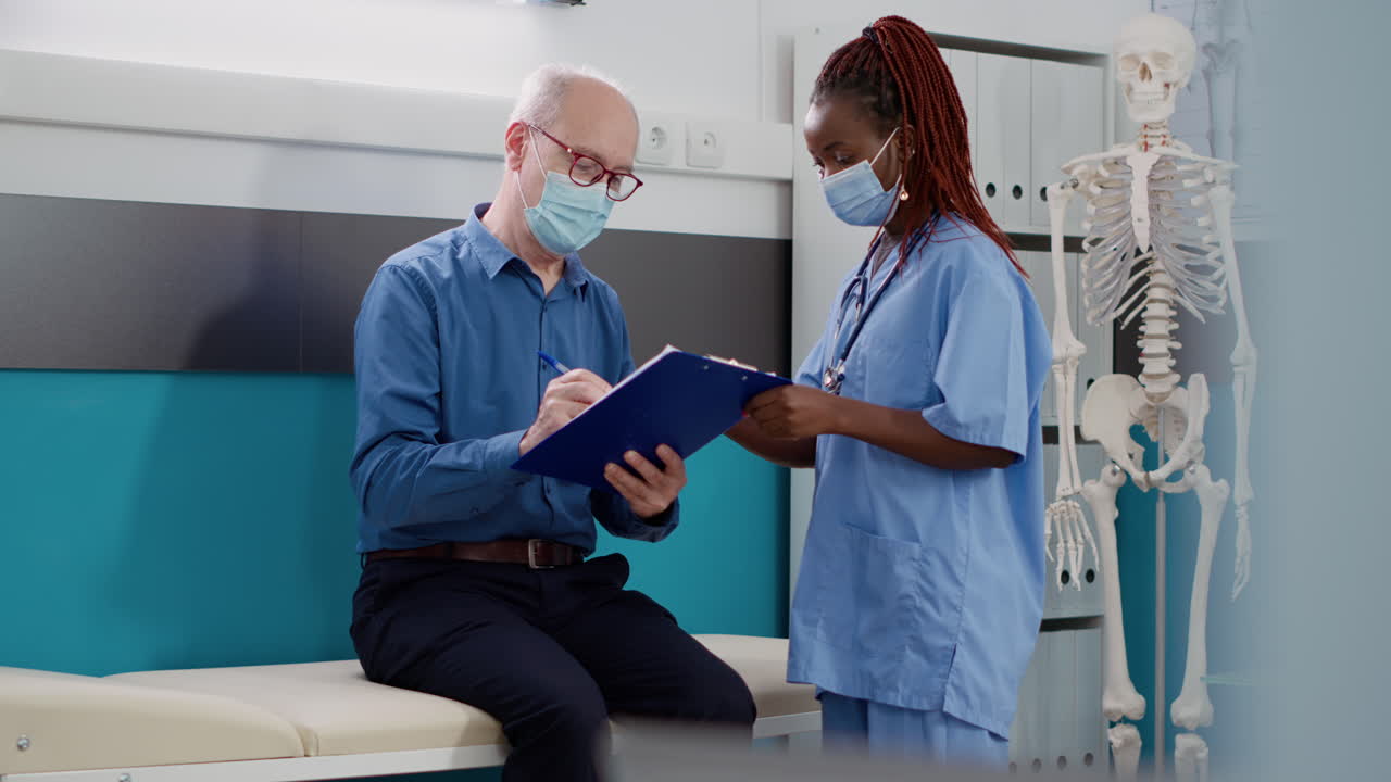 Senior patient consulting with doctor in clinic