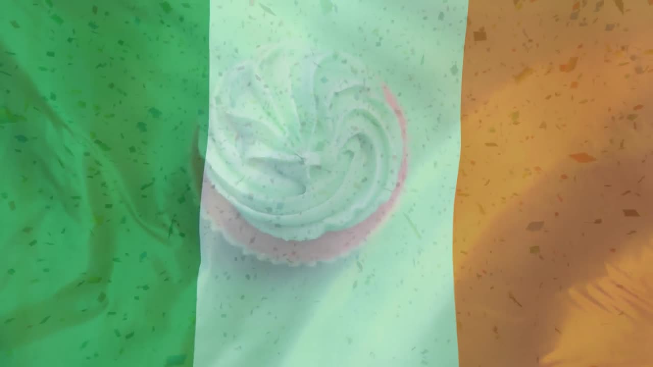 Muffin che ruota su uno sfondo con bandiera irlandese e particelle digitali che cadono