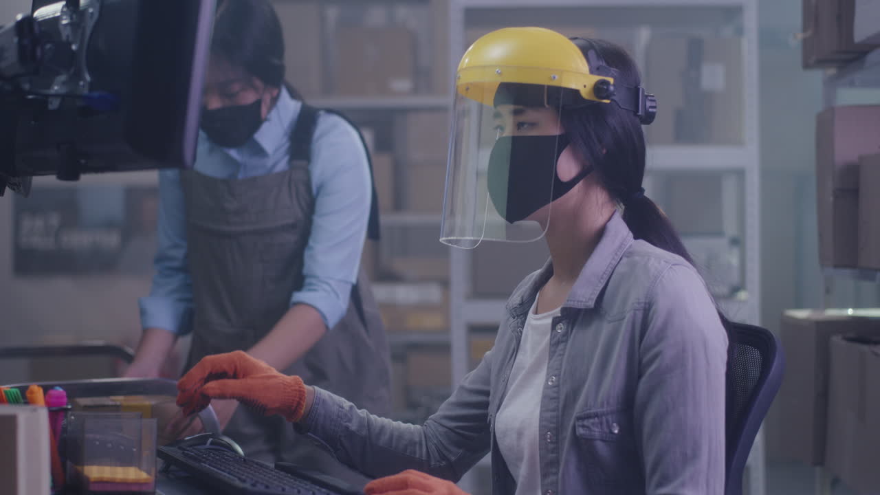 Warehouse Workers Handling Packages During Pandemic