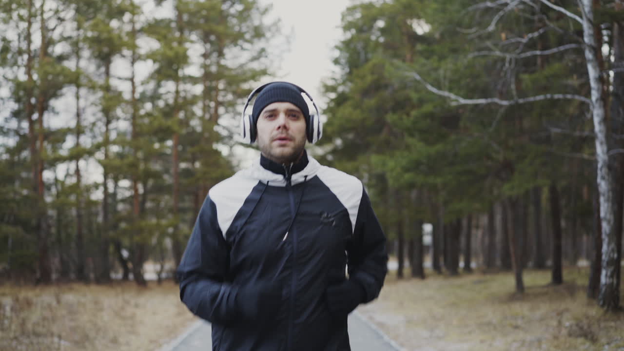 Man Running in a Forest Path