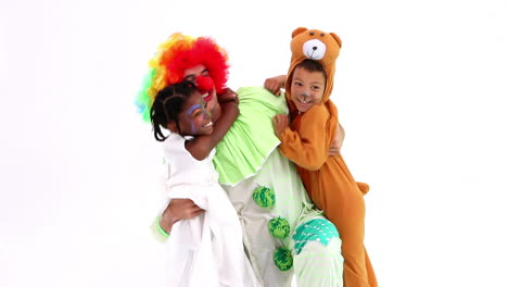 cute children posing with funny clown