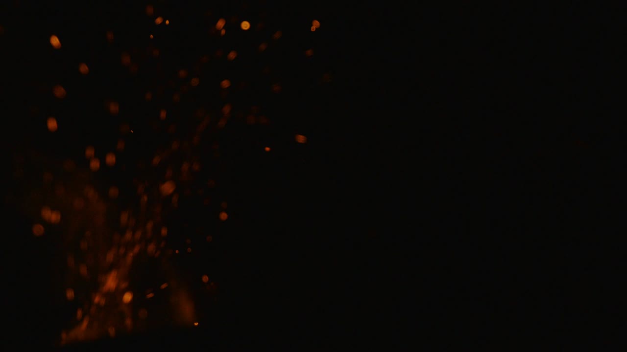 Amazing natural fire with sparks and glowing embers filmed in slow motion