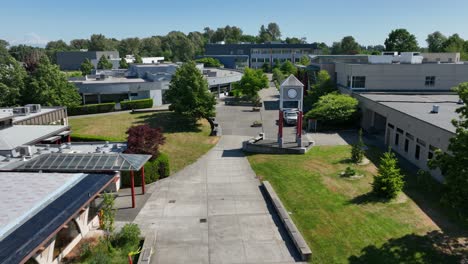 Aerial-view-flying-through-South-Seattle-College's-empty-campus-on-a-warm-summer-day