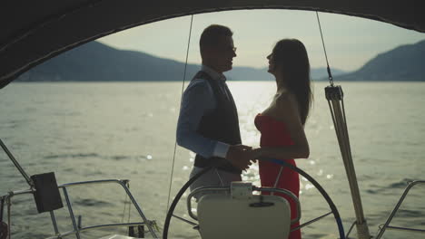 couple on a yacht at sunset