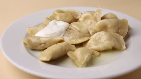 pierogi with sour cream